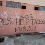 Day Ten – Super Typhoon Yolanda Spray painted sign on the wall of a building in Tacloban City