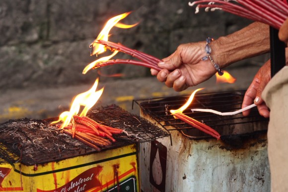 Lighting Prayer Candles in Cebu City, Philippines Lighting Candles Outside Basilica Del Santo Nino in Cebu City