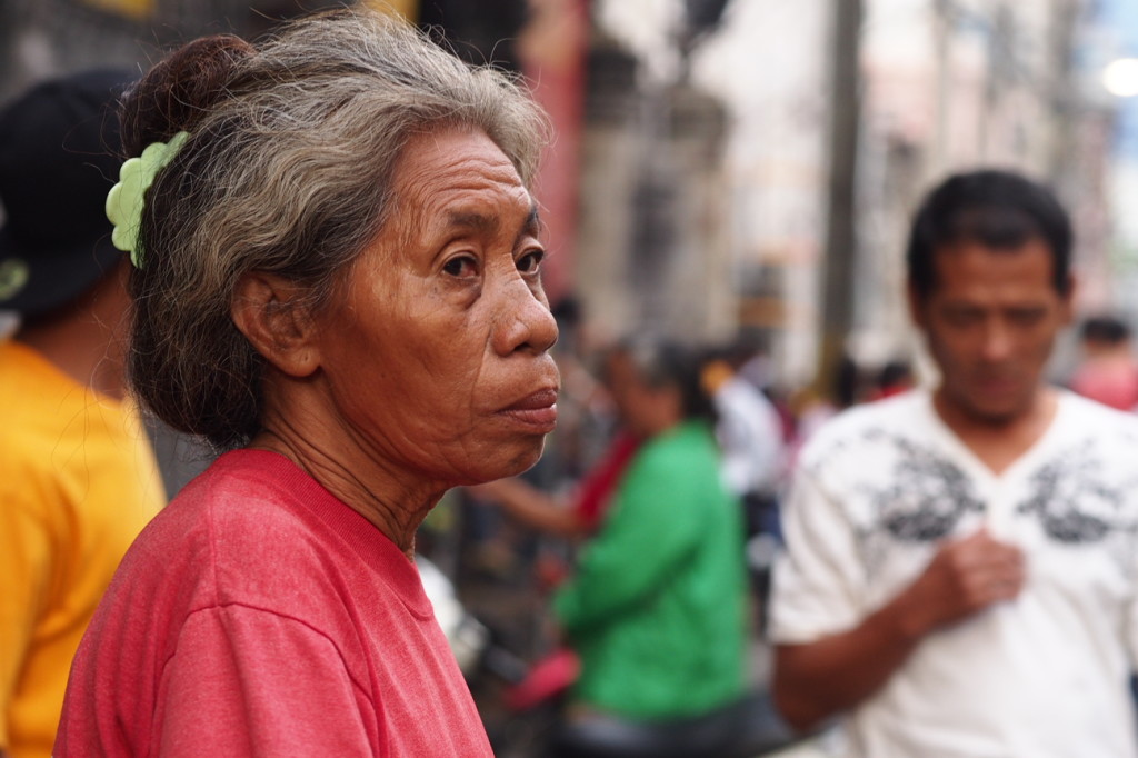Woman Selling Prayer Candles