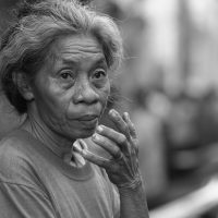 Woman Selling Prayer Candles