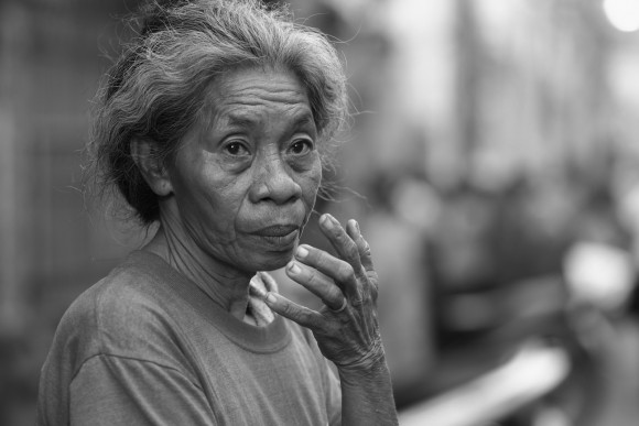 Woman Selling Prayer Candles in Cebu City Woman Selling Prayer Candles