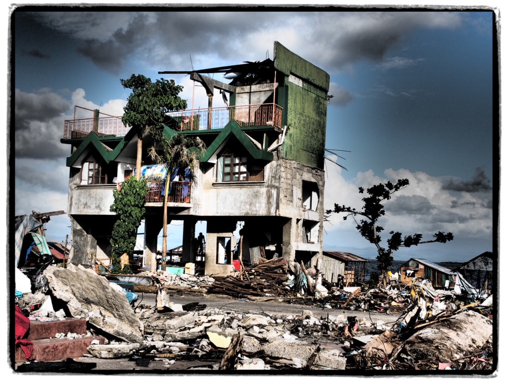 Parts of a cement 3-story house still stand after the typhoon