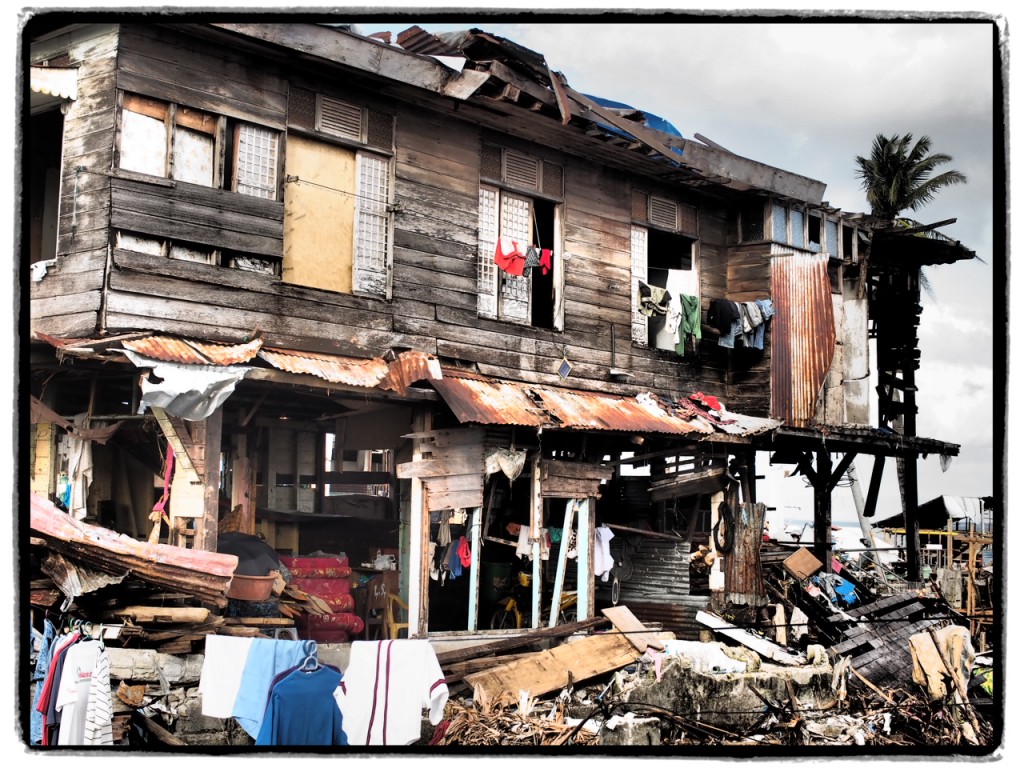 An old wooden house still stands after super typhoon Yolanda
