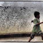 Boy Running from a Wave