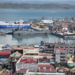 A navy ship docked at Tacloban to deliver relief goods and evacuate people to Cebu or Manila