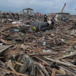 An SUV is surrounded by debris after super typhoon Yolanda