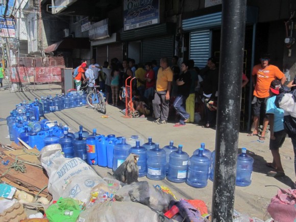 Days 26 & 27 Super Typhoon Yolanda A line-up at a water refilling station in Tacloban