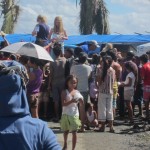 Reps from a New Zealand NGO hand out stuffed animals to children in Tacloban