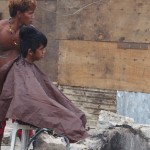 An outdoor barbershop in Tacloban after the typhoon