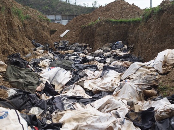 Day 38 Super Typhoon Yolanda – Mass Grave at Basper A pile of bodies lie in one of the mass graves at Basper near Tacloban